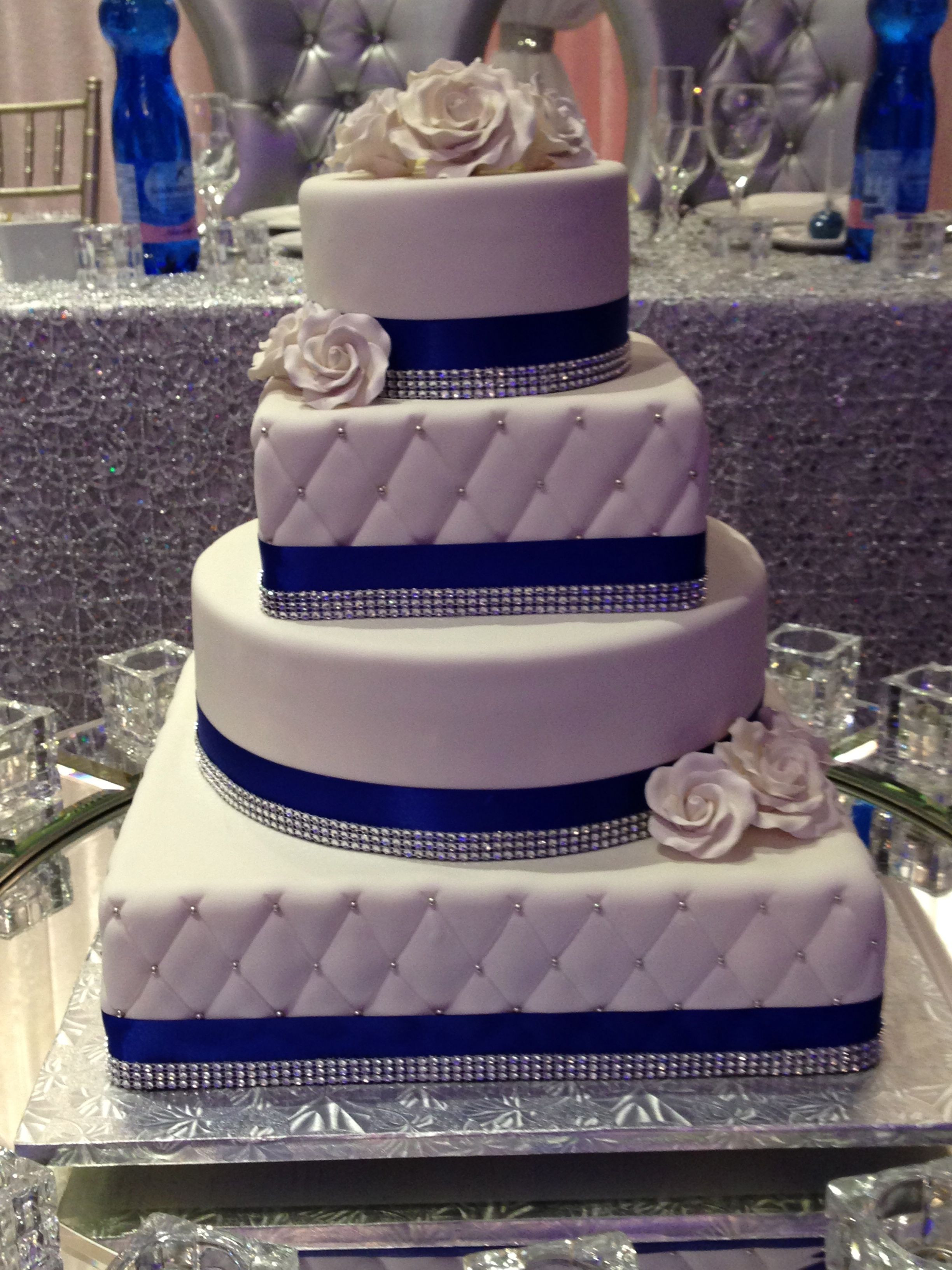 4 Tier Wedding Cakes
 Royal blue trimmed 4 tier round and square wedding cake