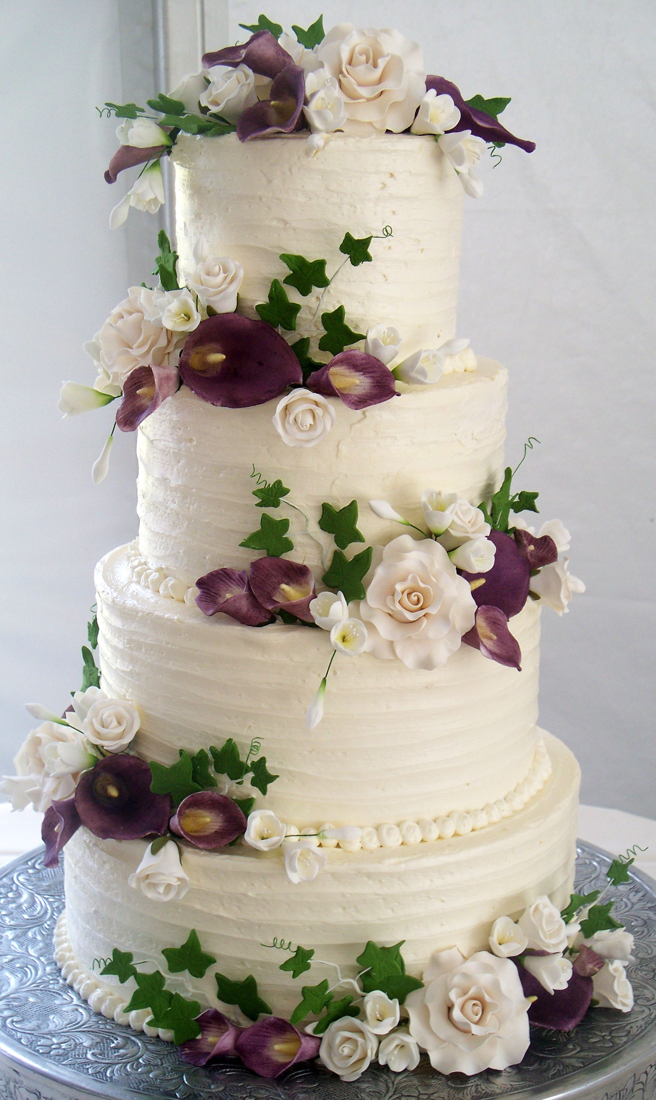 4 Tier Wedding Cakes
 4 tier wedding cake textured buttercream and coordinating