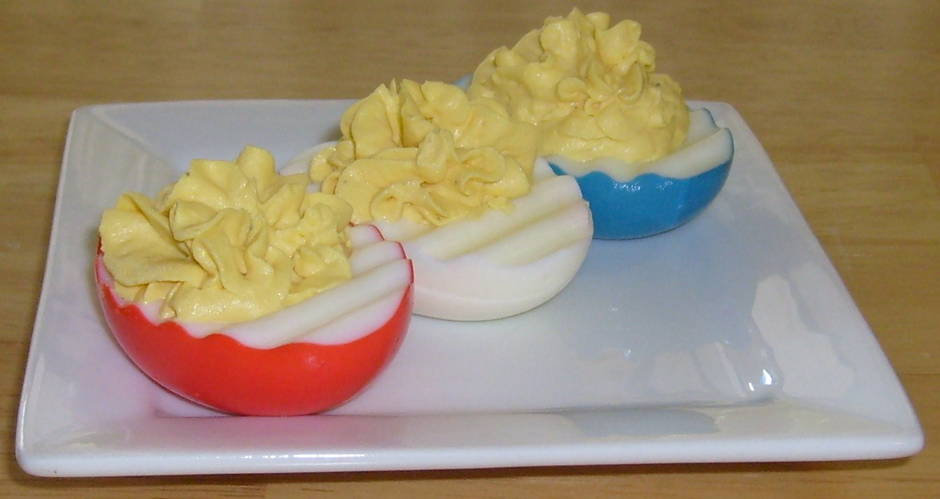4Th Of July Deviled Eggs
 Happier Than A Pig In Mud Stars and Stripes Deviled Eggs
