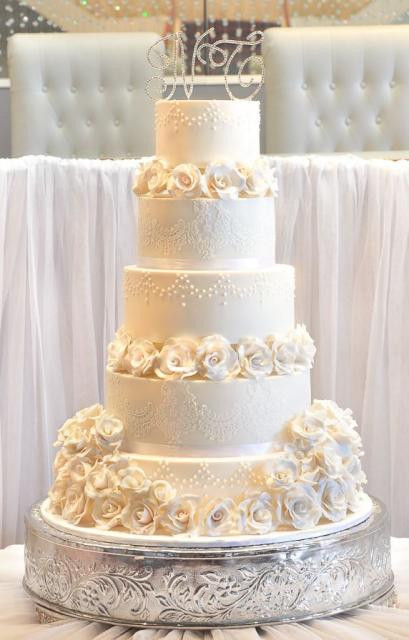 5 Tier Wedding Cakes
 Five tier elegant ivory wedding cake with white roses and