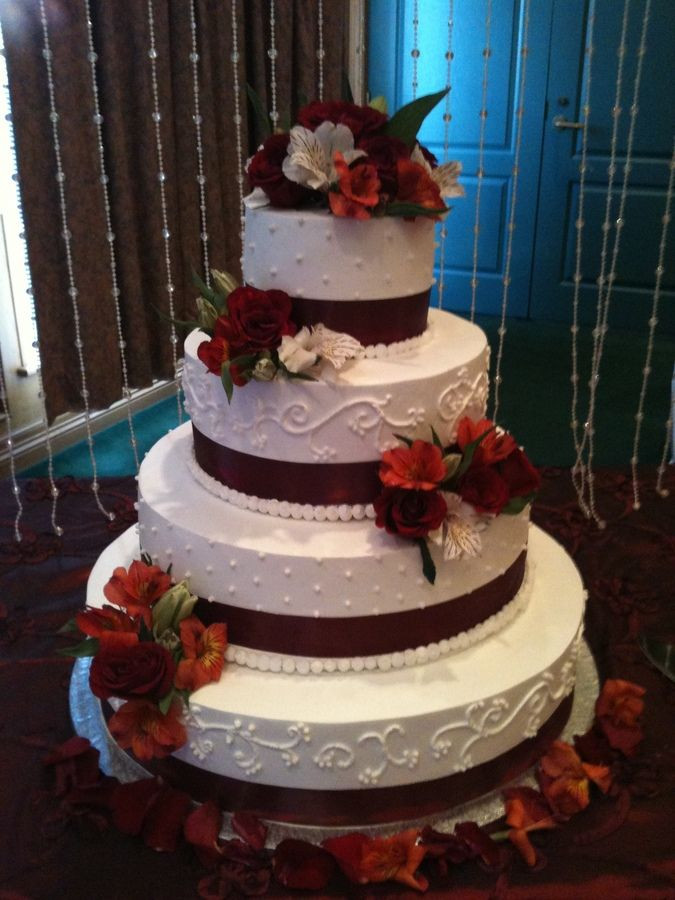Burgundy And White Wedding Cake
 wedding cakes with snowflakes and burgandy ribbon