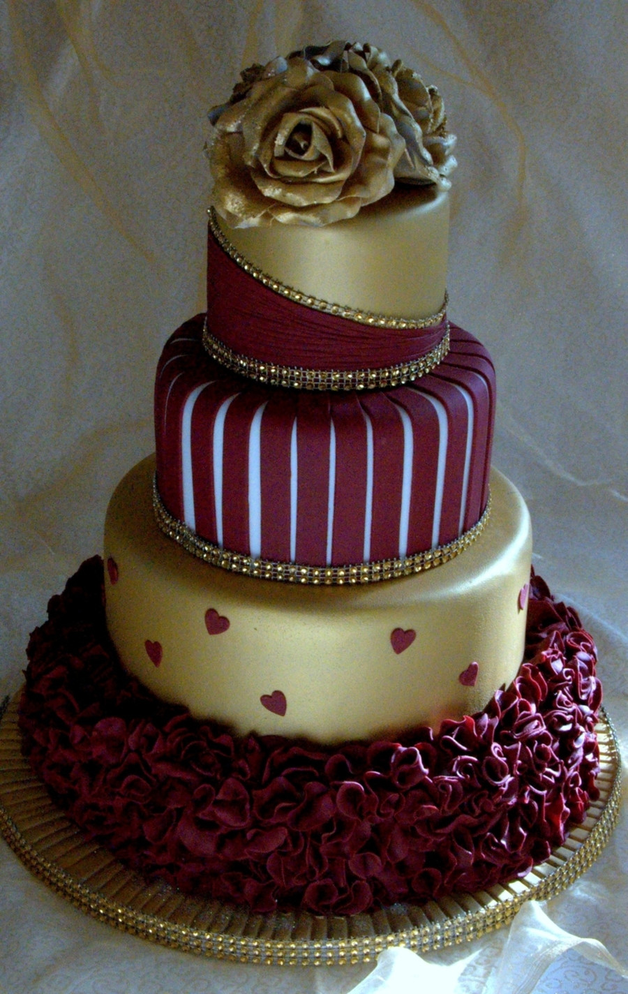 Burgundy Wedding Cakes
 Gold And Burgundy Wedding Cake With Ruffles And Roses