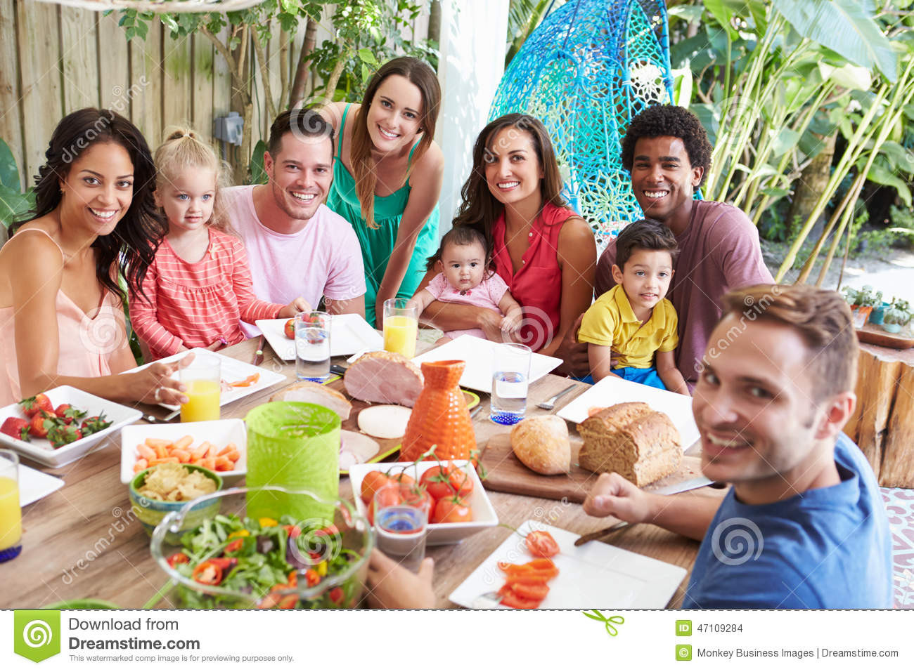 Camping Dinners For Groups
 Group Families Enjoying Outdoor Meal At Home Stock