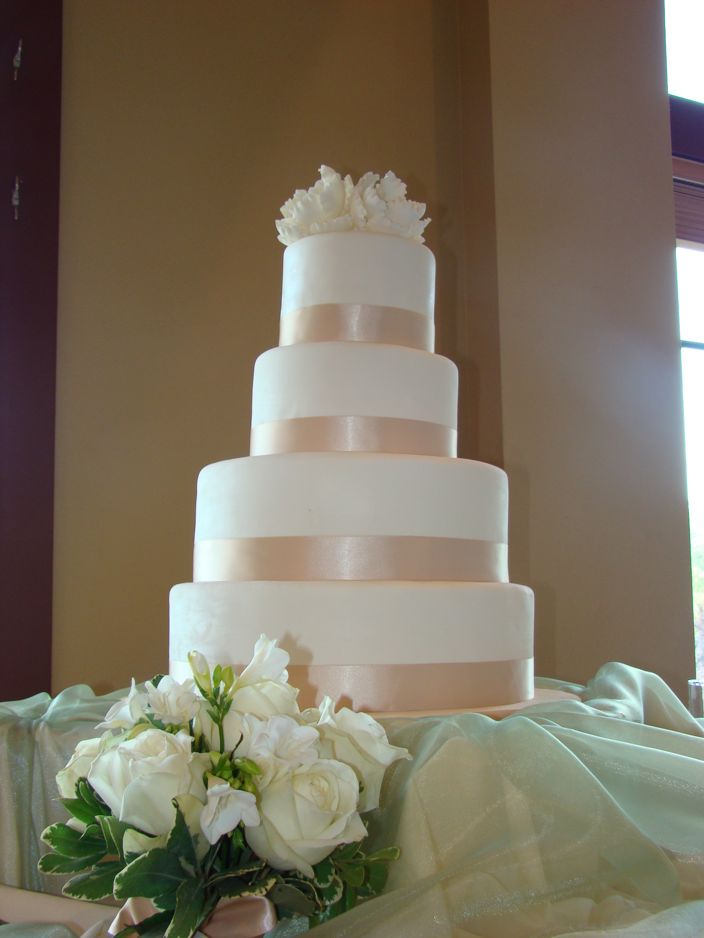 Champagne Wedding Cakes
 4 tier simple and elegant white fondant cake with a