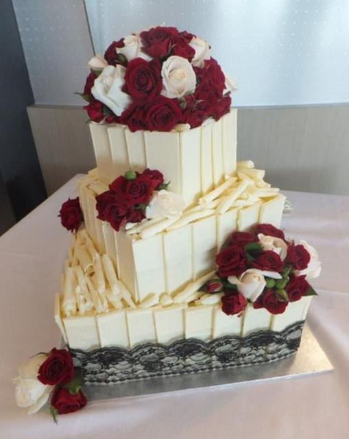 Chocolate And White Wedding Cake
 Three tier white chocolate wedding cake with red and white