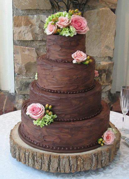 Chocolate Wedding Cakes
 Four tier round chocolate wedding cake with pink roses JPG