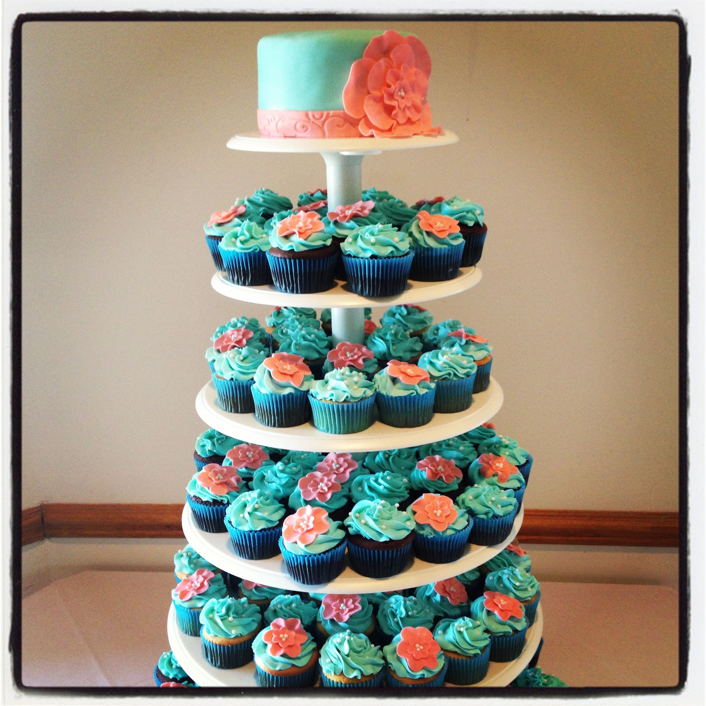 Coral And Teal Wedding Cakes
 Teal & Coral Wedding Cupcake Tower love the idea of