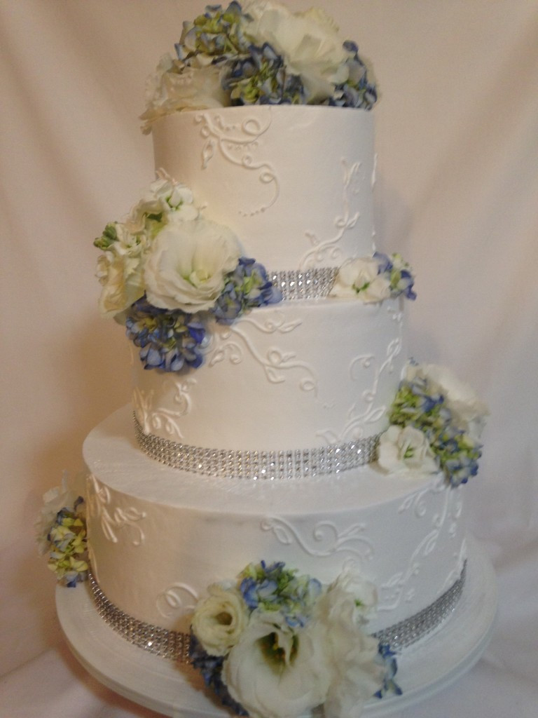 Diamonds Wedding Cakes
 White wedding cake with faux diamonds and fresh flowers