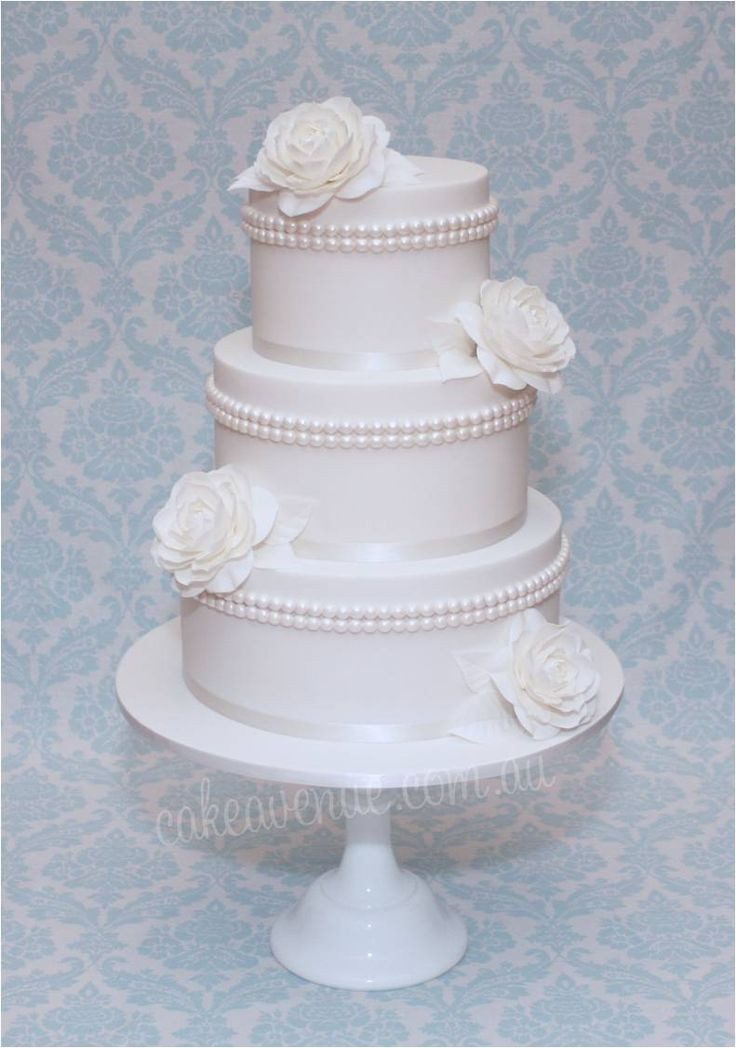 Edible Pearls For Wedding Cakes
 White wedding cake with edible pearls and sugar Camellias