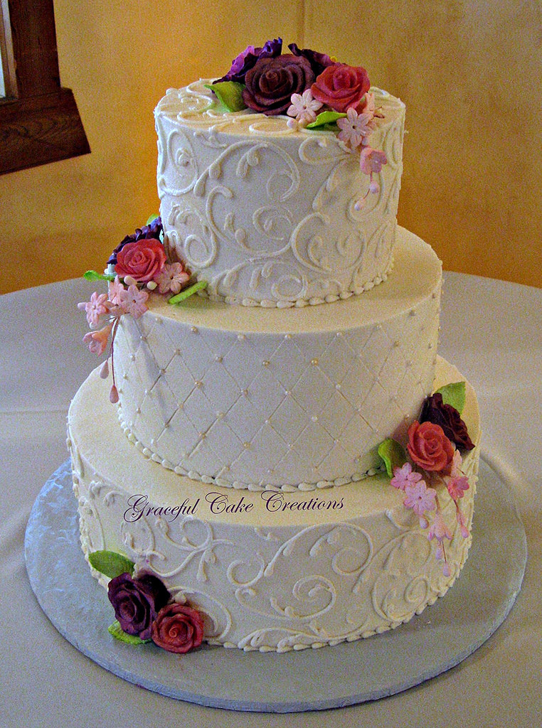 Elegant Buttercream Wedding Cakes
 Elegant Ivory Buttercream Wedding Cake with Purple and Pin