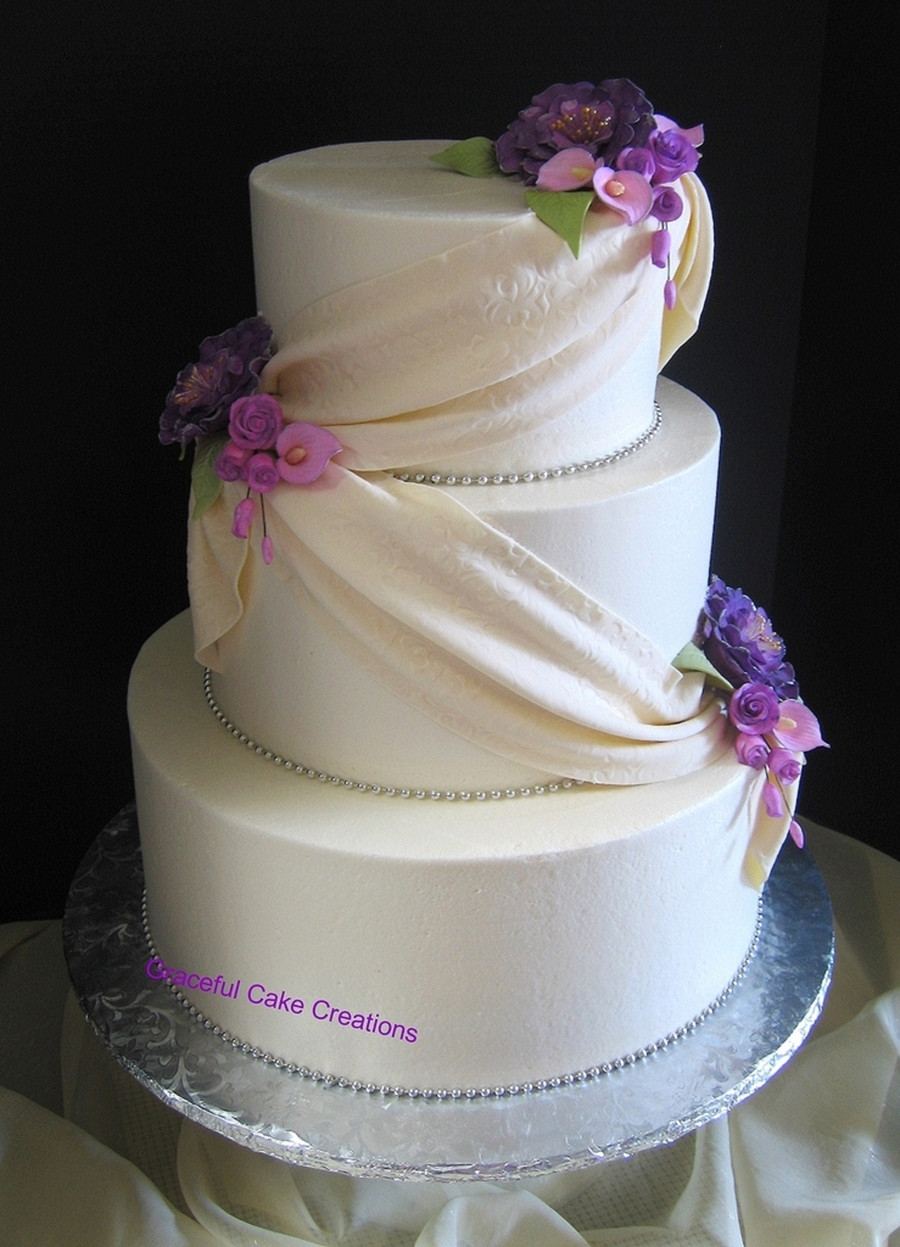 Elegant Purple Wedding Cakes
 Elegant Ivory Wedding Cake With Fondant Swag And Purple