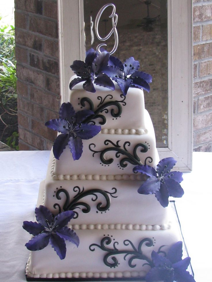 Elegant Purple Wedding Cakes
 Elegant purple & floral wedding cake done exclusively by