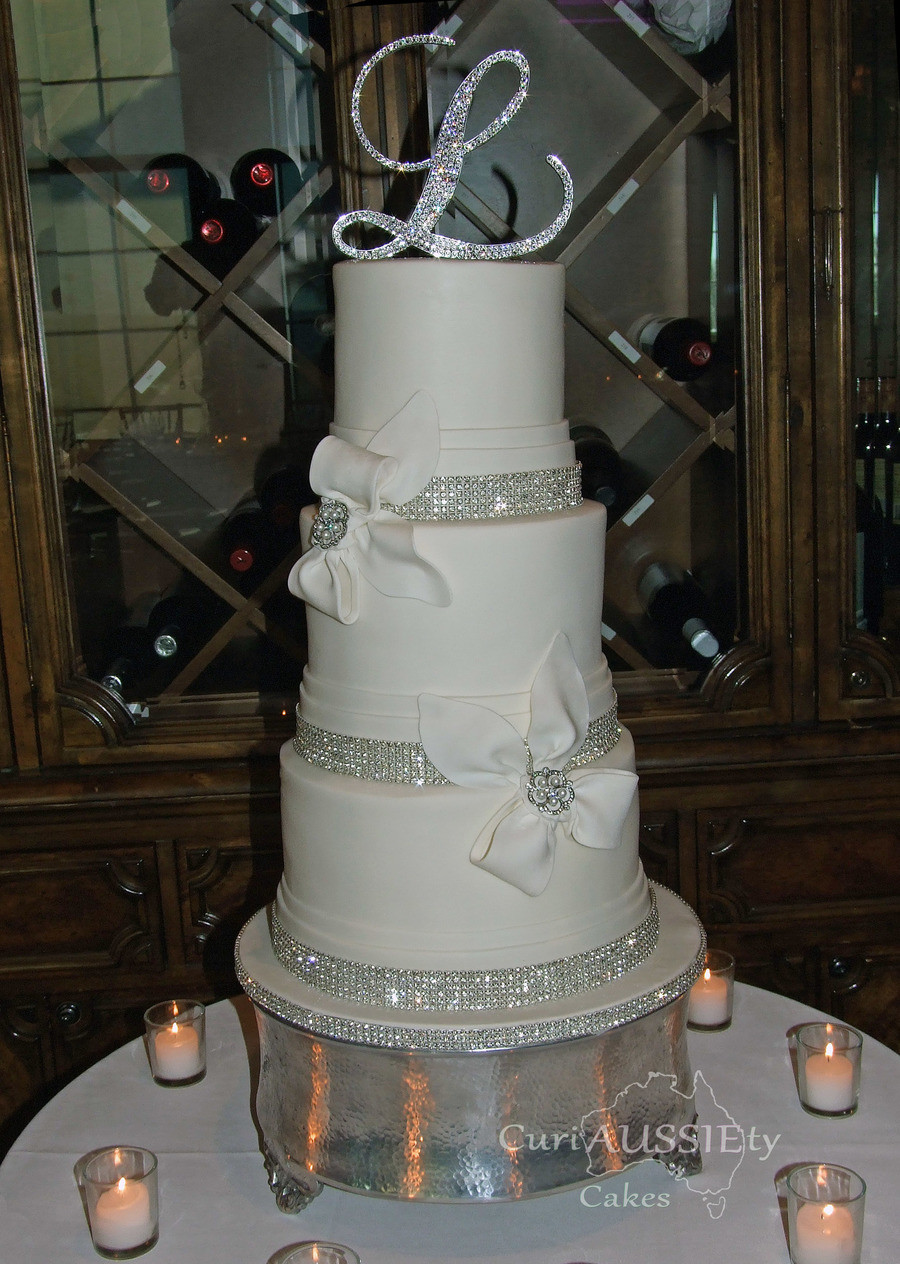 Elegant Wedding Cakes With Bling
 Elegant White Bow And Bling Wedding Cake CakeCentral