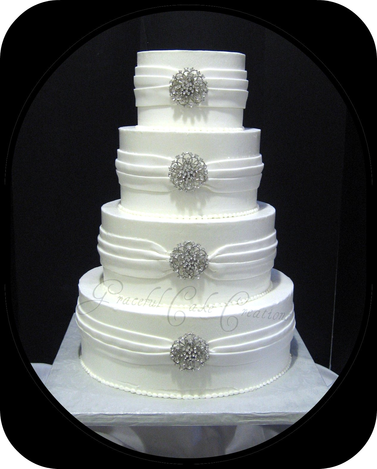 Elegant White Wedding Cakes
 Elegant White Wedding Cake with Silver Jewelry