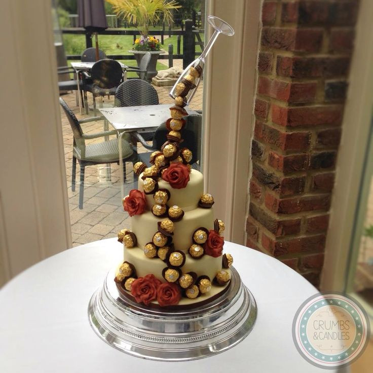 Ferrero Rocher Wedding Cakes
 Ferrero Rocher wedding cake with hand made sugar roses