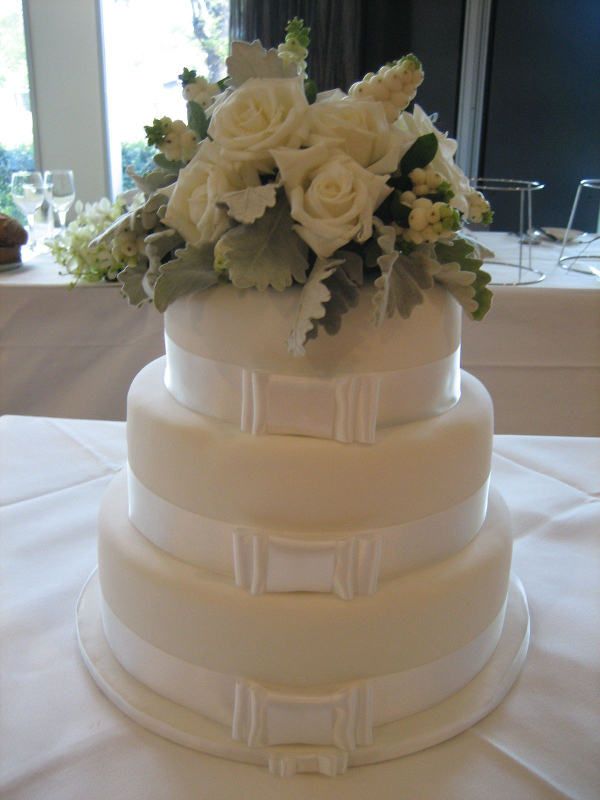 Fresh Flowers On Wedding Cakes
 Fresh flower wedding cake topper using white roses dusty