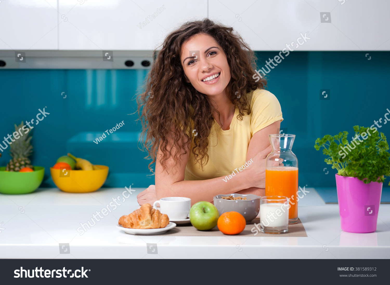 Healthy Breakfast At Home
 Young Woman Having Breakfast At Home Eating Healthy Food