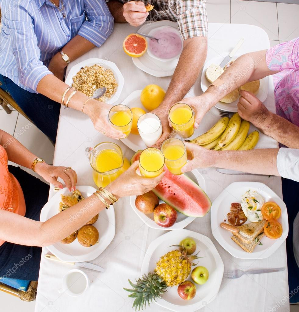 Healthy Breakfast For Group
 Overhead view of group of having breakfast — Stock