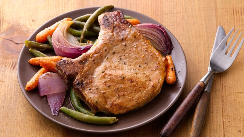 Healthy Way To Cook Pork Chops
 Oven Roasted Pork Chops and Ve ables recipe from Betty