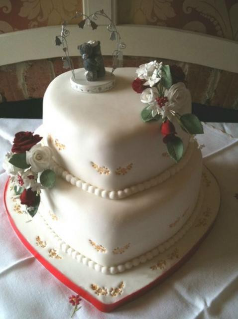 Heart Shaped Wedding Cakes
 2 tier heart shaped wedding cake with pearl strings JPG