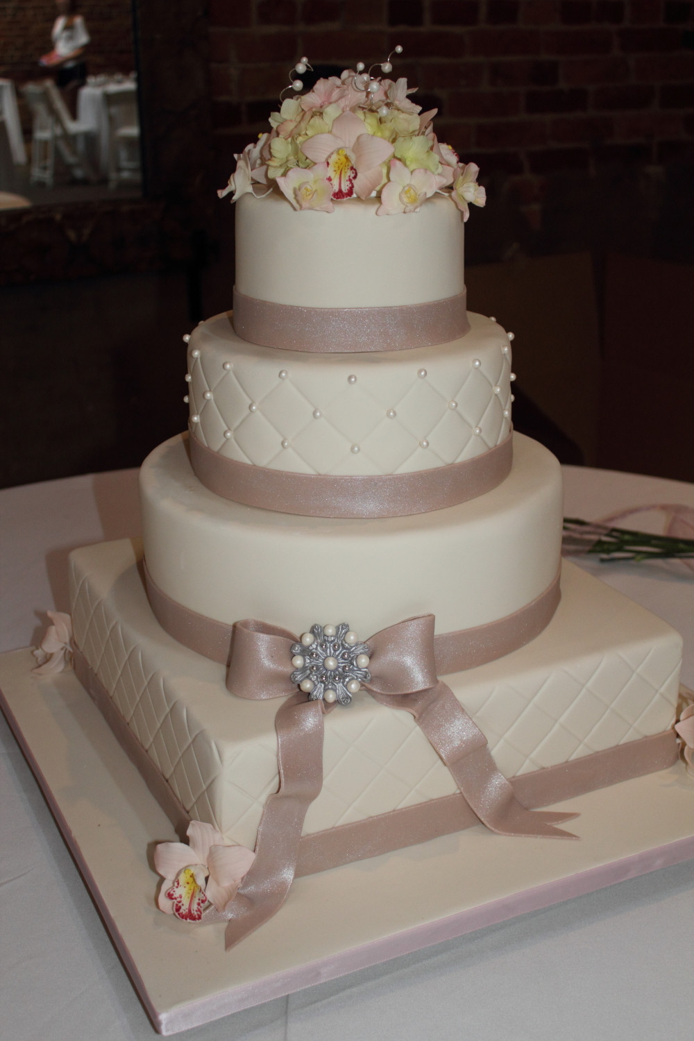 Ivory Wedding Cakes
 The Cake Engineer Ivory Wedding Cake with Champagne Bow