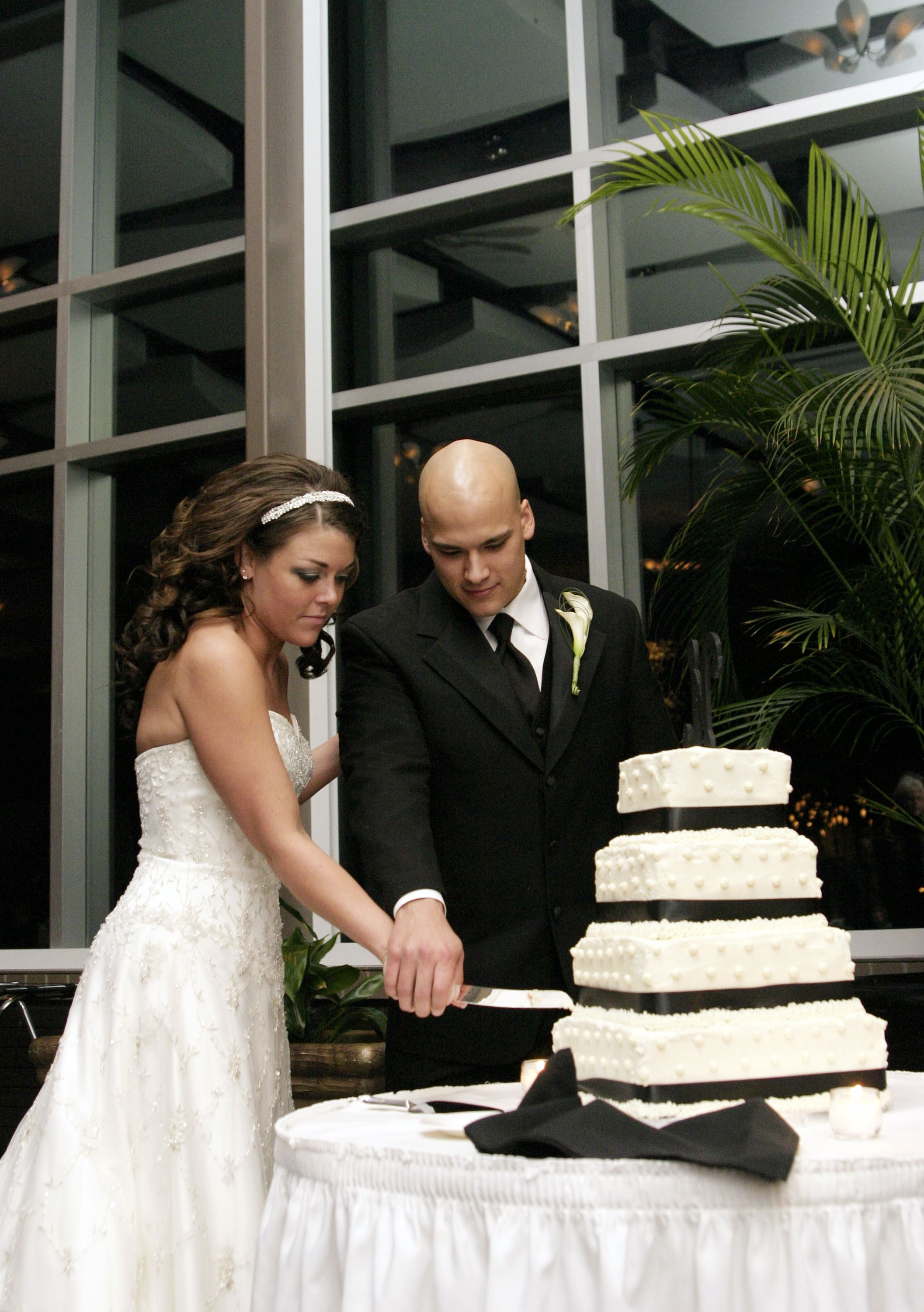 Meijers Wedding Cakes
 Bride and Groom cutting black and white wedding cake