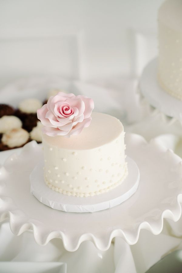 Mini Wedding Cakes
 mini white wedding cake and pink sugar flower