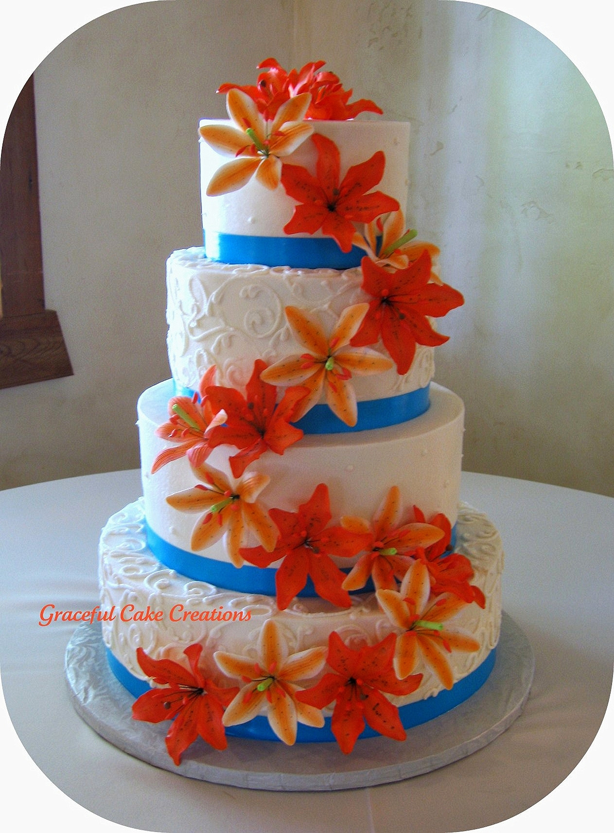 Orange And Blue Wedding Cakes
 Tropical Wedding Cake with Orange Tiger Lilies and Malibu