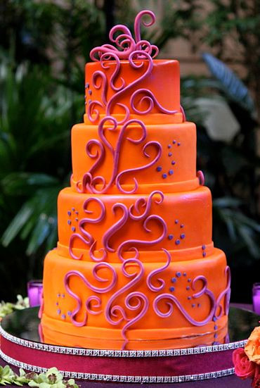 Orange And Purple Wedding Cakes
 Four tier round orange wedding cake with purple wave decor JPG