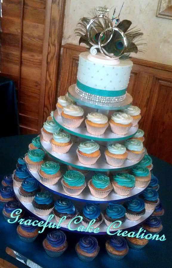 Peacock Wedding Cake With Cupcakes
 Peacock Themed Cupcake Wedding Cake in an Ombre Design