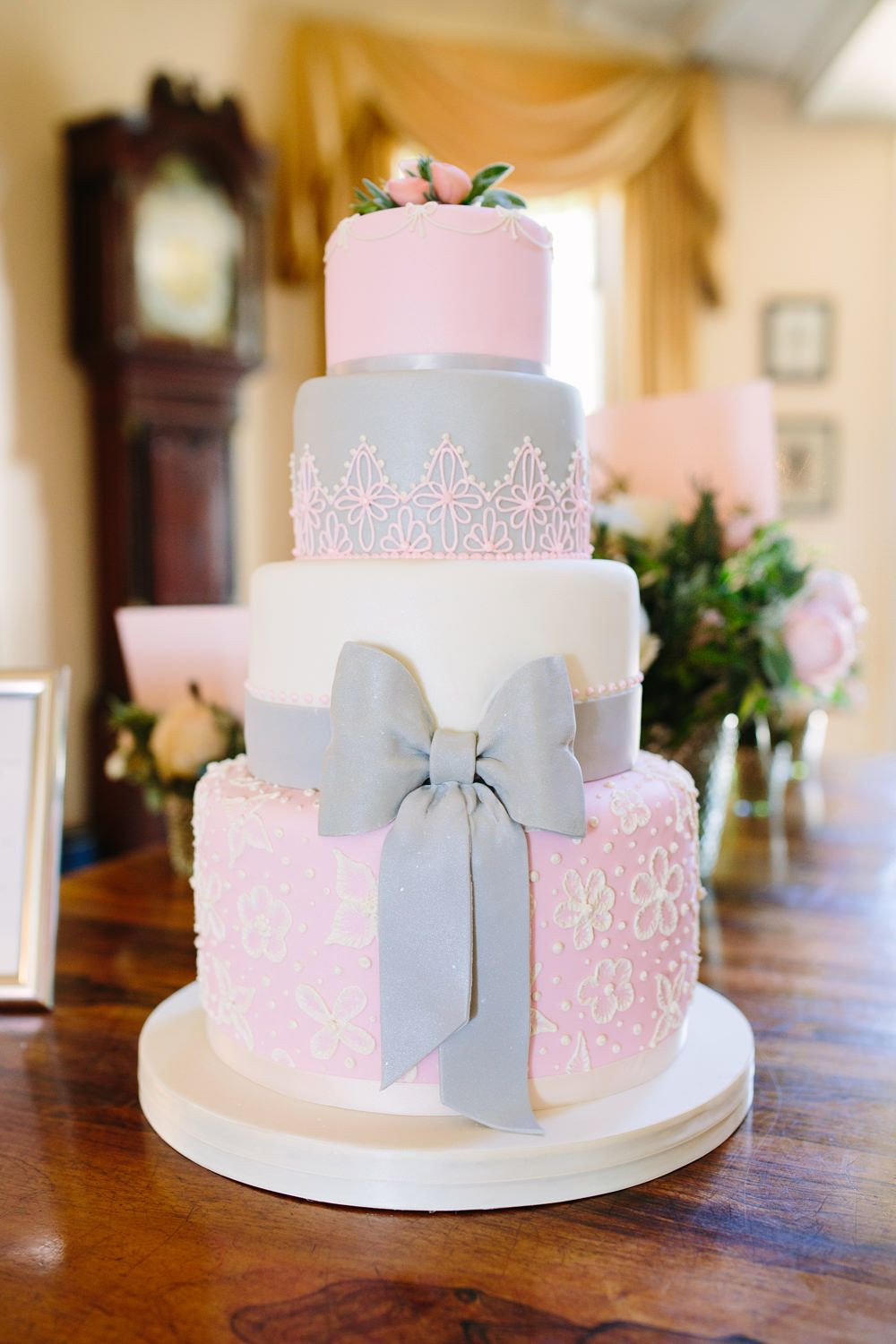 Pink And Grey Wedding Cakes
 Pronovias Leonela Wedding Gown & Coast Bridesmaid
