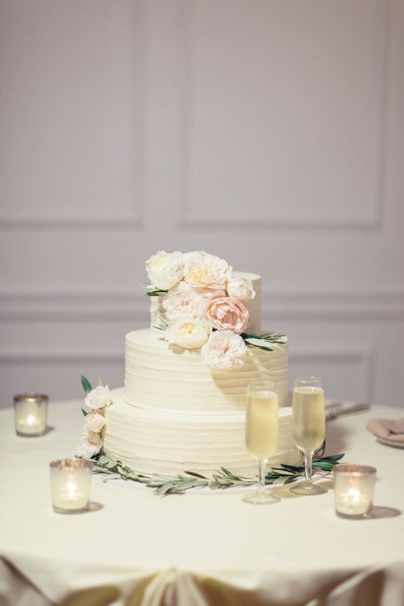 Portos Bakery Wedding Cakes
 Ivory Wedding Cake With Pastel Colored Flowers