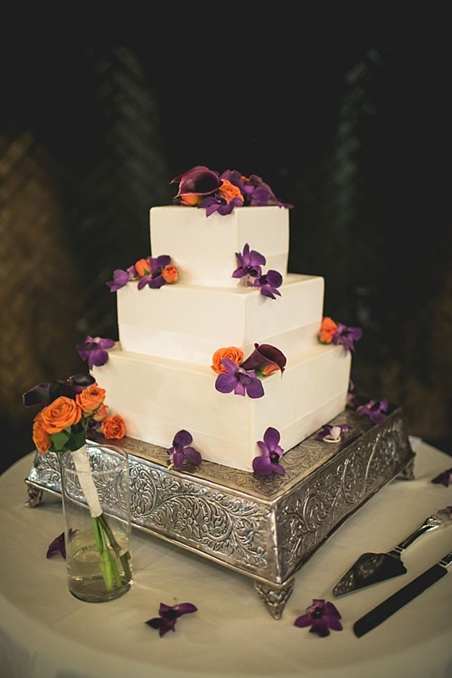 Purple And Orange Wedding Cakes
 Wedding cake with orange and purple flowers