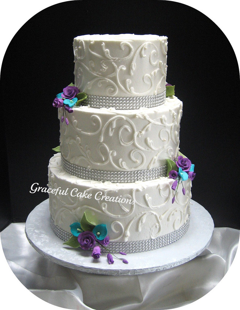Purple And Teal Wedding Cakes
 Elegant White Wedding Cake with Crystal Ribbon accented