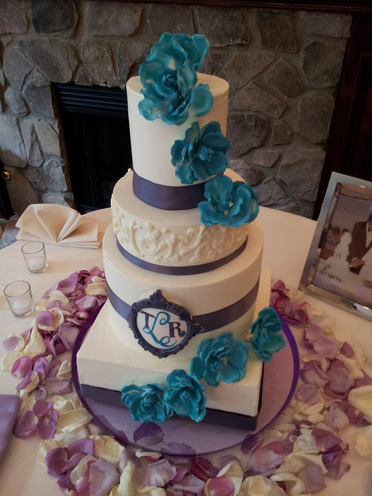 Purple And Turquoise Wedding Cakes
 Purple and turquoise Buttercream wedding cake with satin