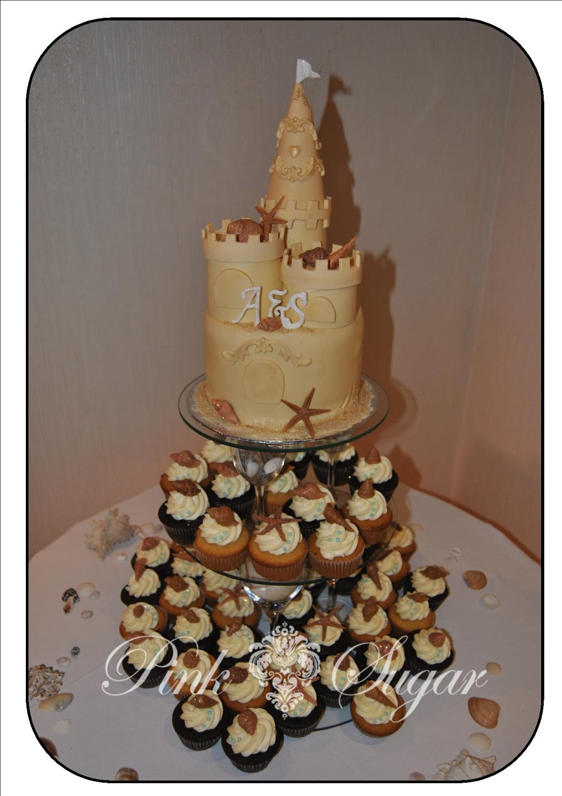 Sandcastle Wedding Cakes
 Pink Sugar Sandcastle Wedding Cake & Cupcakes