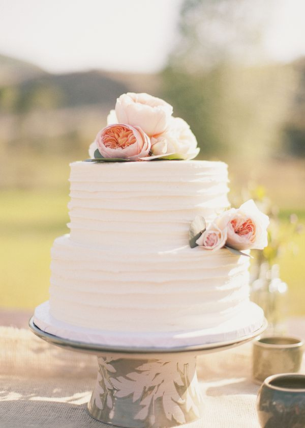 Simple 2 Tiered Wedding Cakes
 White two tier wedding cake with textured frosting and