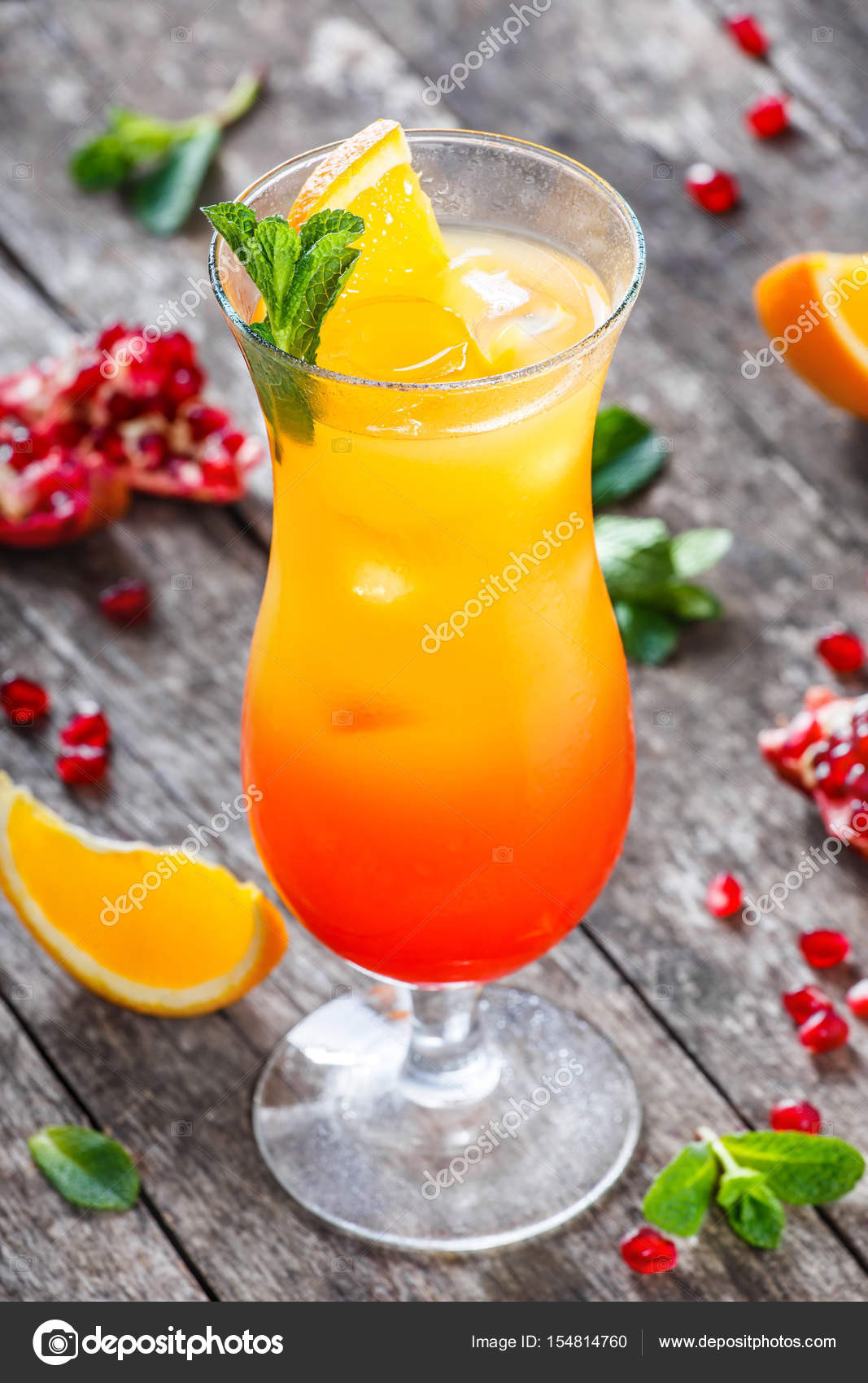 Summer Drinks With Tequila
 Tequila sunrise cocktail with mint orange and pomegranate