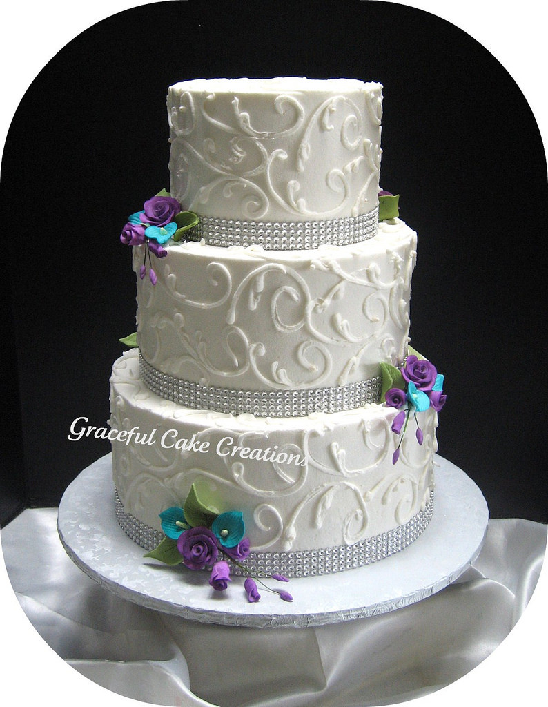 Teal And Purple Wedding Cakes
 Elegant White Wedding Cake with Crystal Ribbon accented