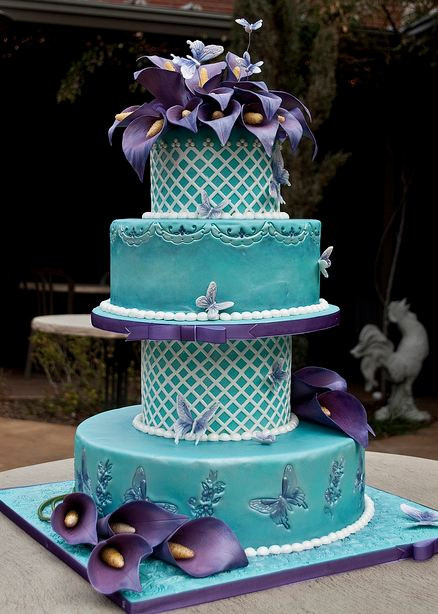 Teal And Purple Wedding Cakes
 Four tier teal wedding cake with butterfly imprints and