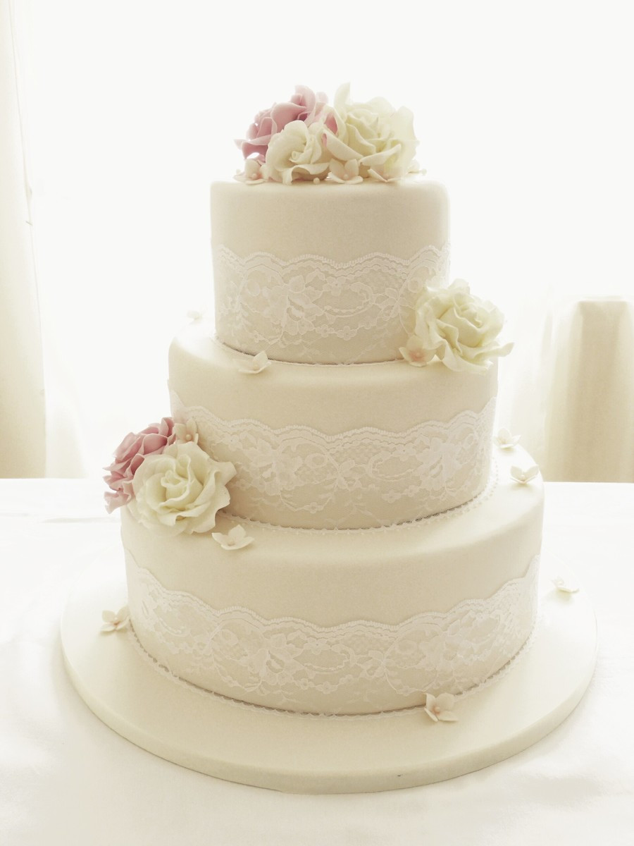 Three Tier Wedding Cakes
 Ivory Roses And Lace Three Tier Wedding Cake CakeCentral