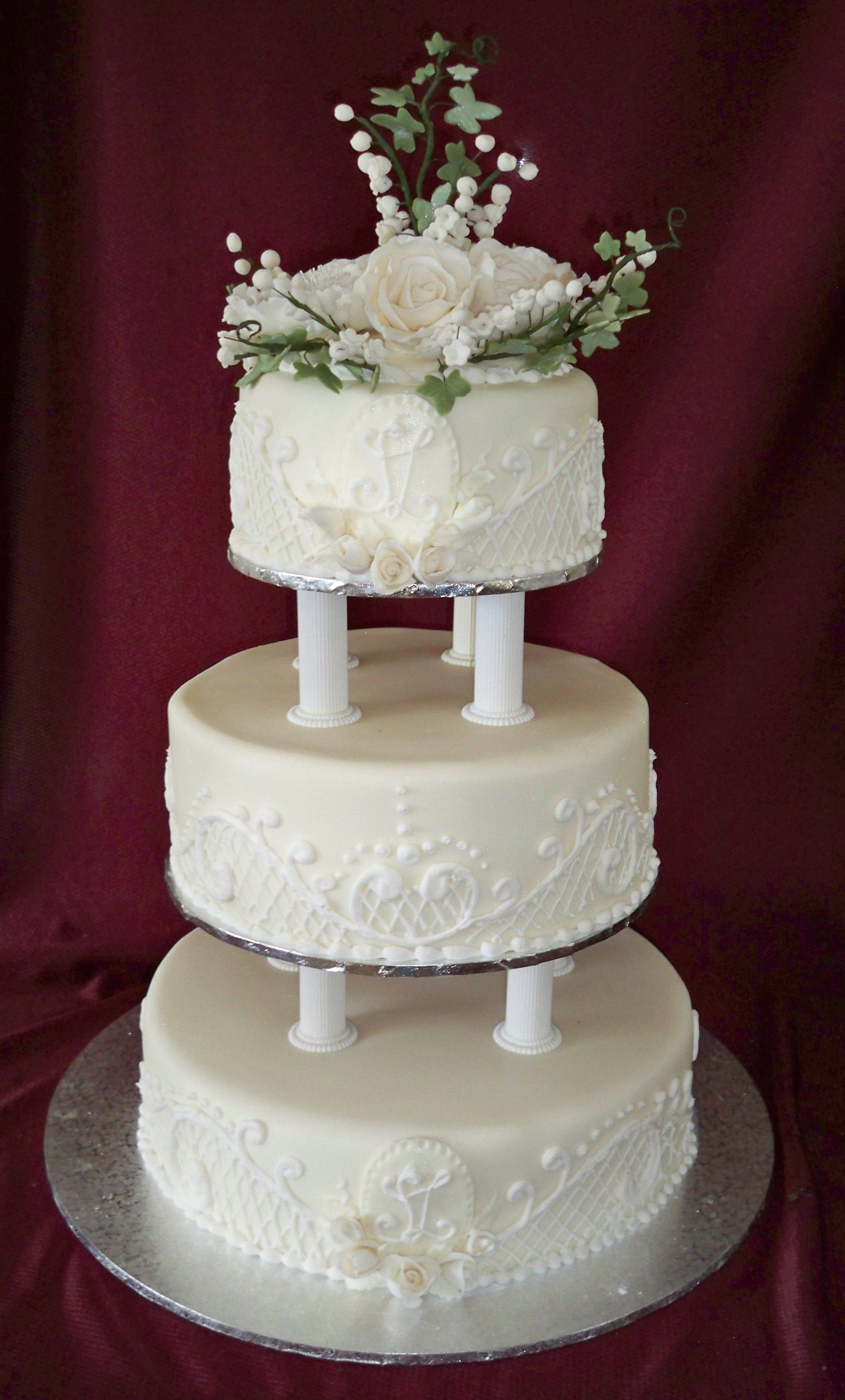 Tiered Wedding Cakes
 3 tier round traditional wedding cake with lace piping and