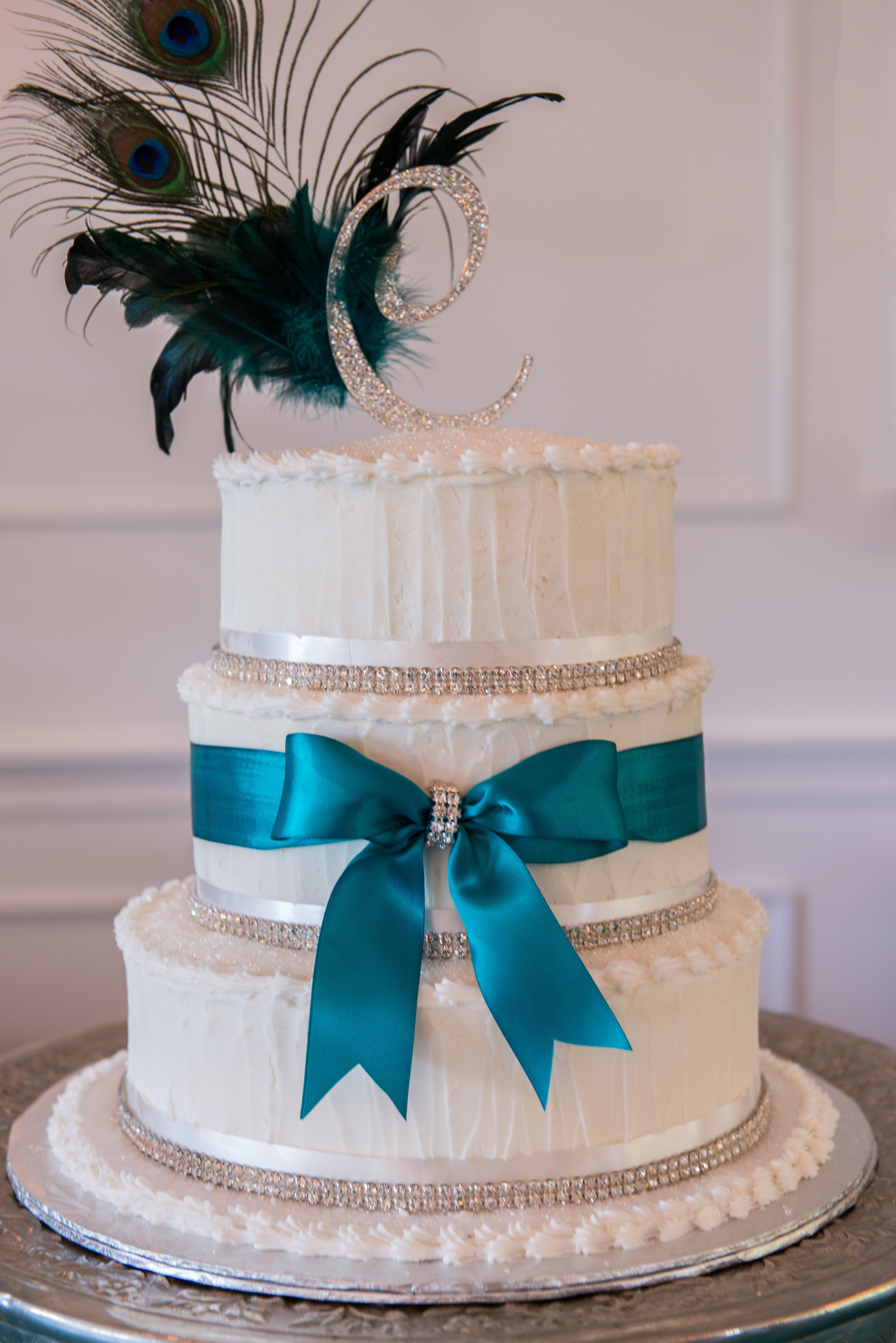 Turquoise And White Wedding Cakes
 White Wedding Cake with Turquoise Ribbon and Peacock