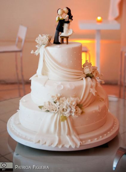 Wedding Cakes Bride And Groom
 Three tier white wedding cake with drape and kissing bride