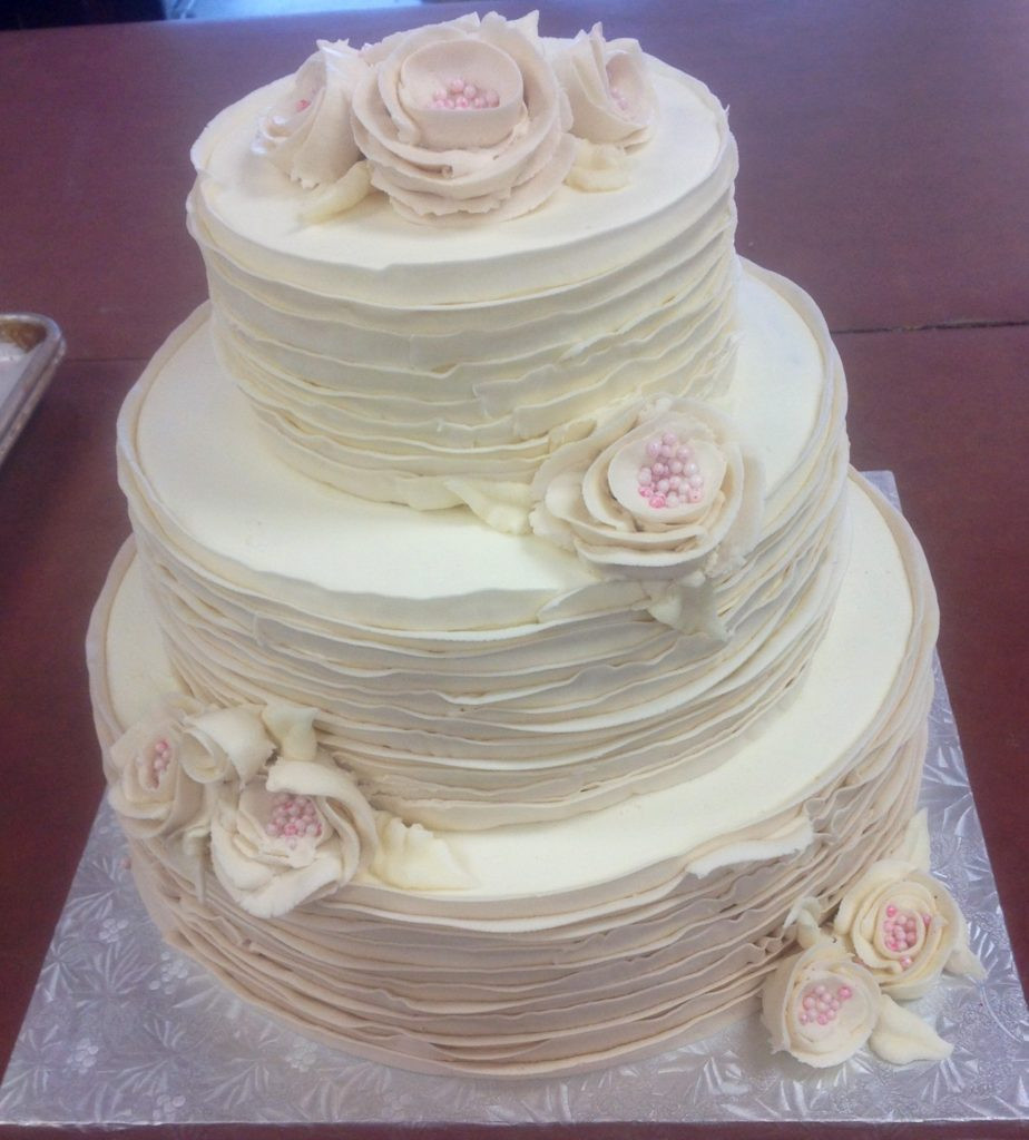 Wedding Cakes Buttercream Frosting
 Tiered Streamlined Wedding Cake with Fresh Flowers and