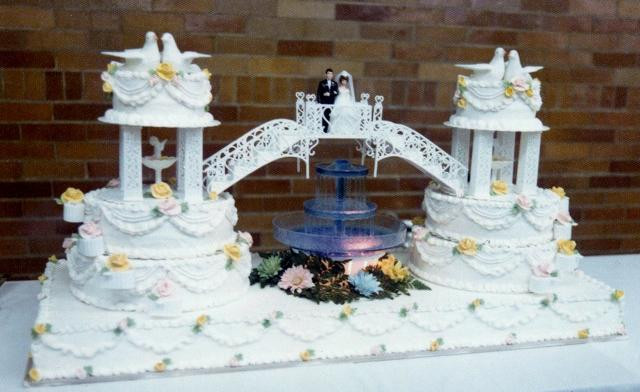 Wedding Cakes Fountains
 Unique Double Wedding Cake connected by bridge with bride