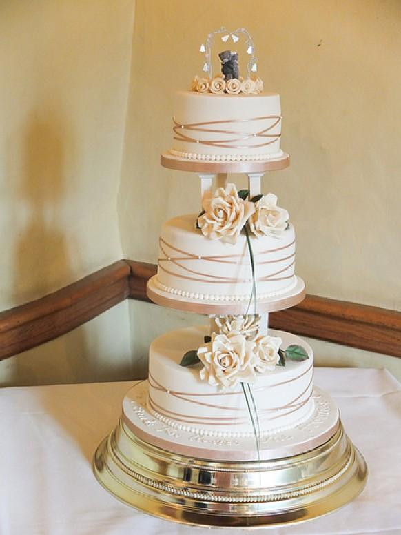 Wedding Cakes Pillars
 Ivory Wedding Gold & Ivory Cake With Pillars