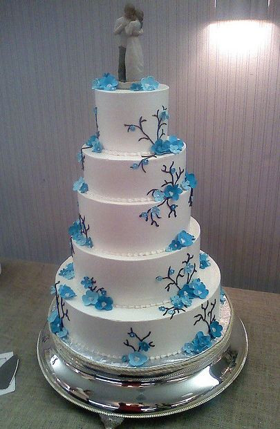 Wedding Cakes With Blue Flowers
 Five tier round white wedding cake with blue flowers and