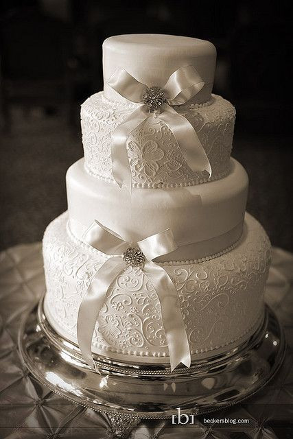 Wedding Cakes With Bows
 White lace pattering design white bow round 4 tier