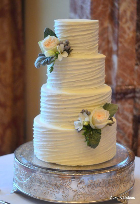 Wedding Cakes With Buttercream Frosting
 Simple 2 tier cake with rippled white icing and 2